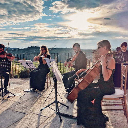 MusicPortrait orchestra playing outdoors.
